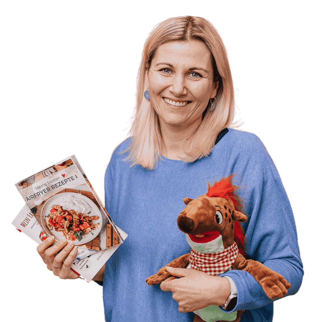Jenny Jenny mit Buch und Kört als Kuscheltier
